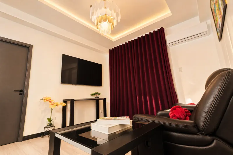 Sitting area with crimson curtains