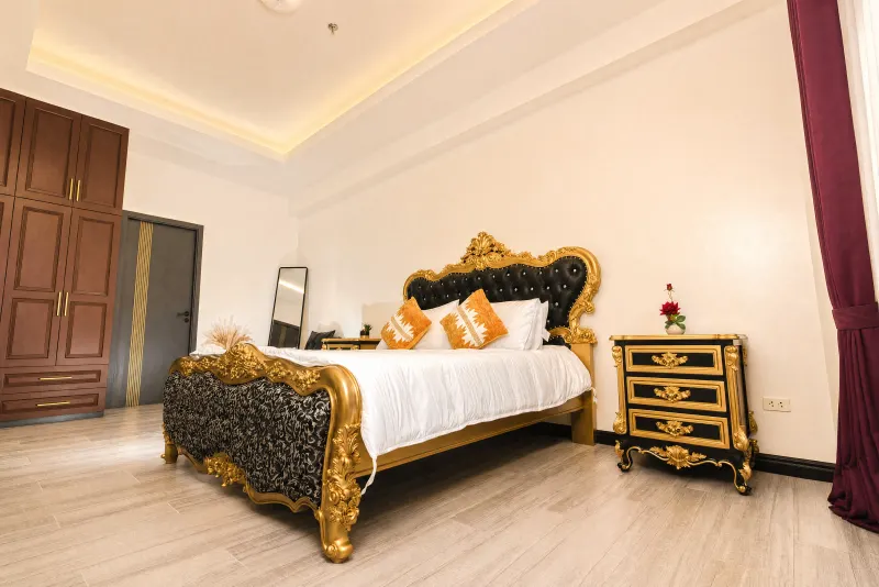 Carved gold bed and matching wardrobe