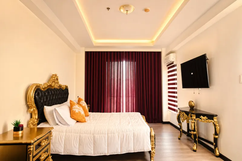 Master bedroom in gold and crimson