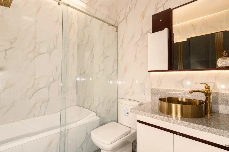 Marble bathroom with brass fixtures