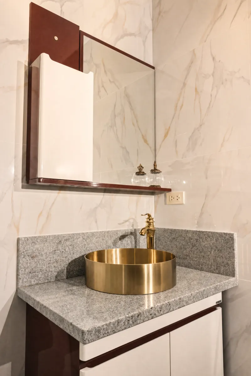 Vanity with brass vessel basin
