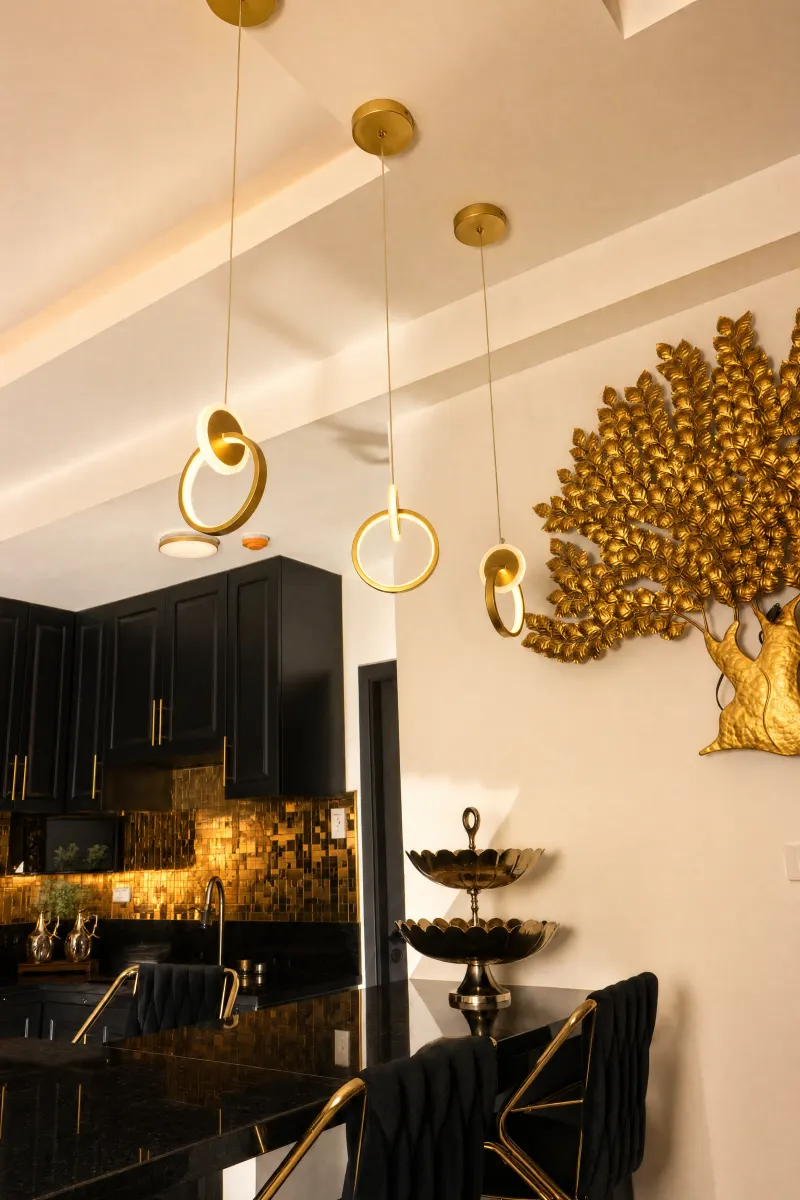 Kitchen with sculptural gold pendants