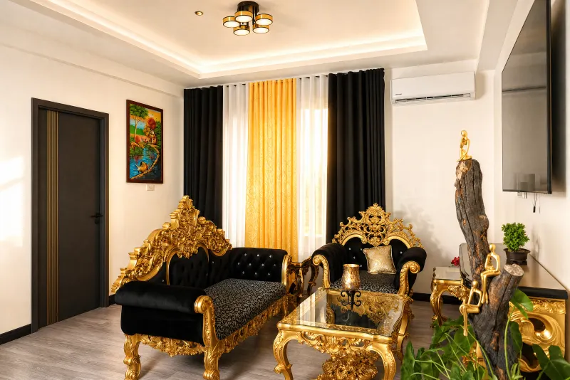 Gilded seating framed by gold drapery
