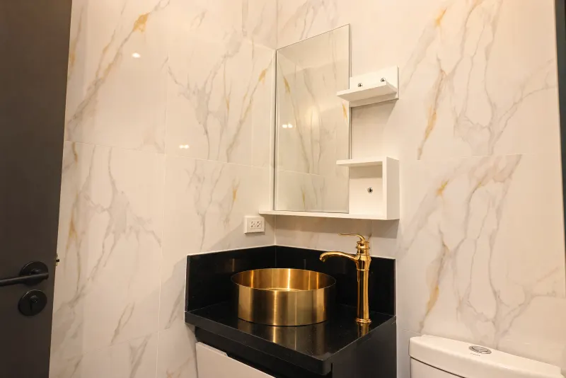 Vanity with brass vessel basin