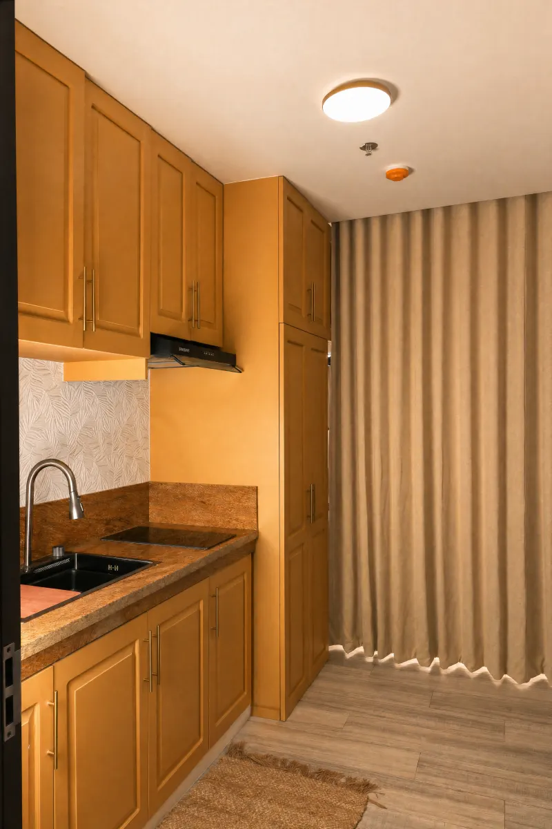 Studio kitchenette in warm narra hardwood