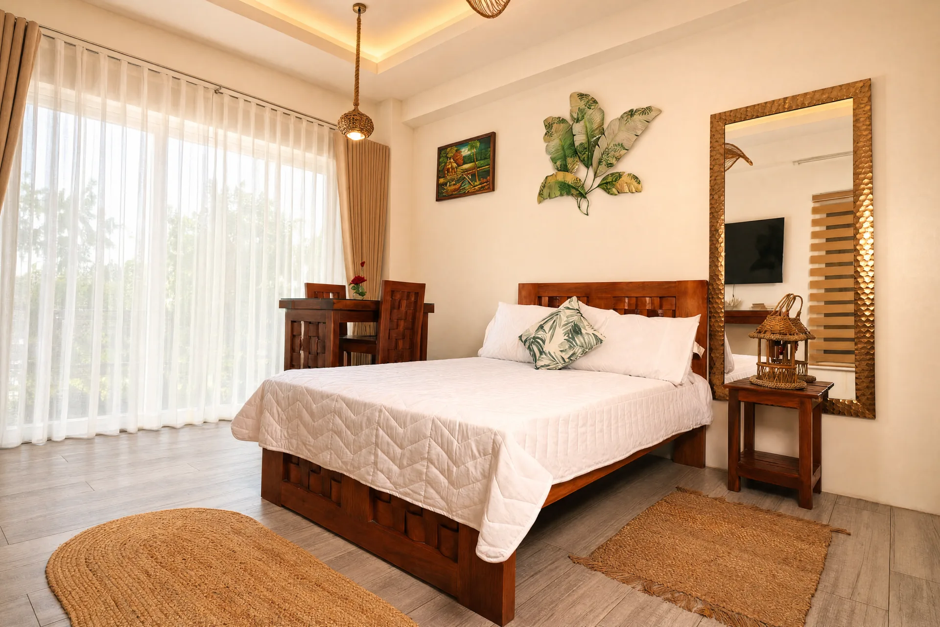 Studio bedroom with balcony doors and morning light
